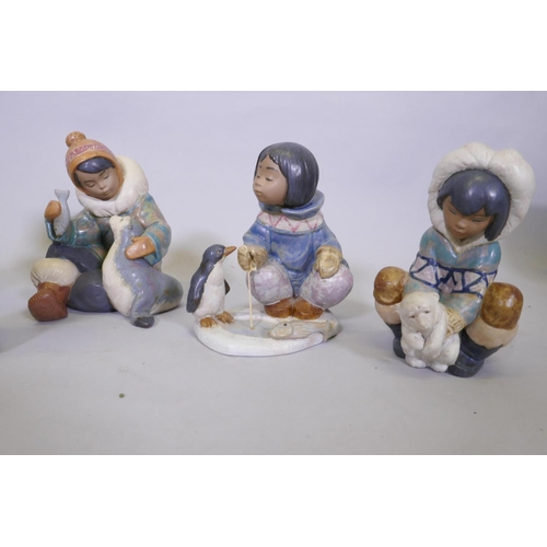 29 - Five Lladro figures of Eskimos, No 12236 Frosty Outing, 28cm high; No 2361, Cold Weather Companions;... 