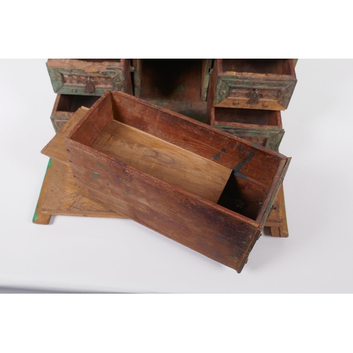 34 - An Indian painted wood box, fitted with drawers, 29 x 23cm, 18cm high