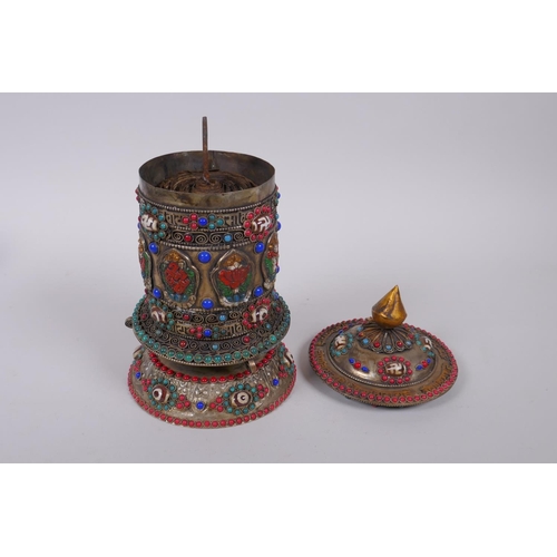 55 - A Tibetan white metal prayer wheel with painted details, set with agate eye beads, turquoise etc, 21... 