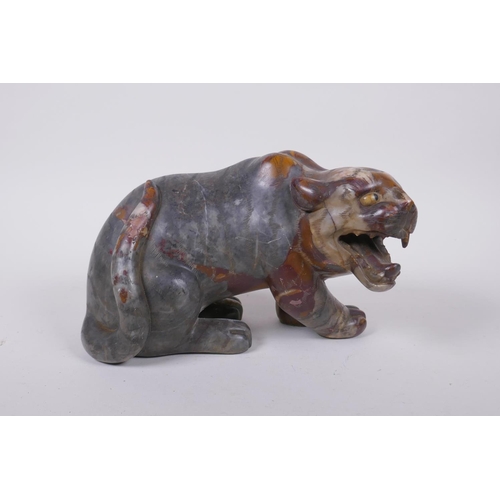 59 - A Chinese carved soapstone tiger, 23cm long