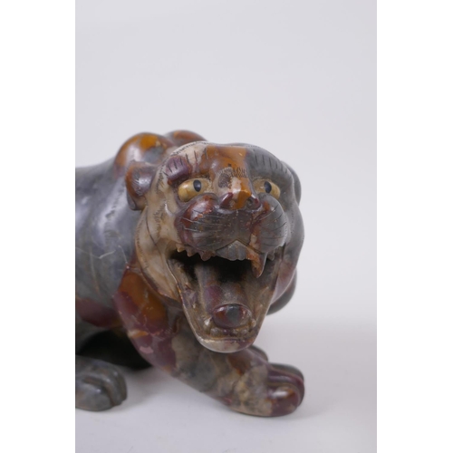 59 - A Chinese carved soapstone tiger, 23cm long