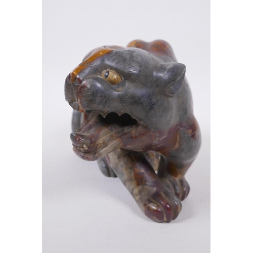 59 - A Chinese carved soapstone tiger, 23cm long