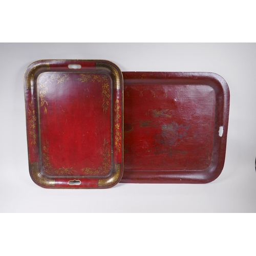 63 - A red ground Toleware tray with gilt decoration of birds and a fountain, and another smaller, larges... 