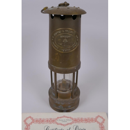 68 - A Cambrian Lampworks brass miner's flame safety lamp by E. Thomas & Williams Ltd, with instructi... 