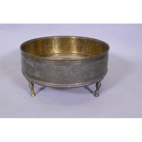 7 - An antique Indo Persian brass brasserie and conical cover, raised on tripod supports, with chased an... 