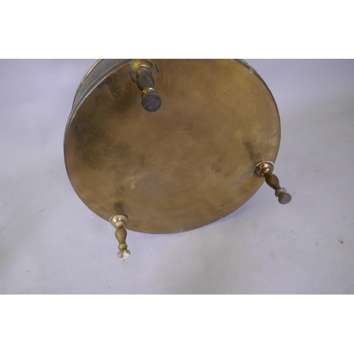 7 - An antique Indo Persian brass brasserie and conical cover, raised on tripod supports, with chased an... 