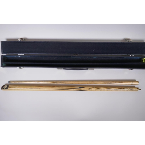 74 - A James Howard Snooker Masters cue, in a Jimmy White branded leather carry case, 81cm long