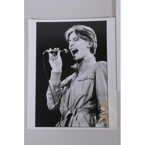 75 - A collection of five black and white press photographs of David Bowie circa 1976, including one by M... 