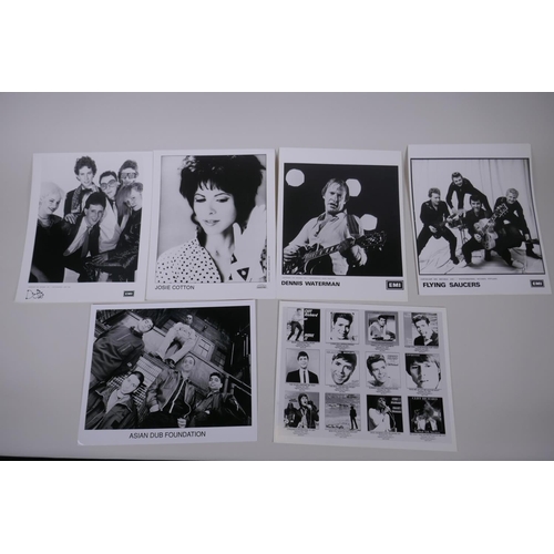 77 - A quantity of black and white press and promotional photographs of musicians including Dolly Parton,... 