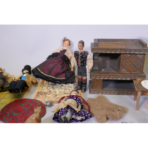 8 - A collection of dolls' house furniture, carpets, figures and C17th style furniture