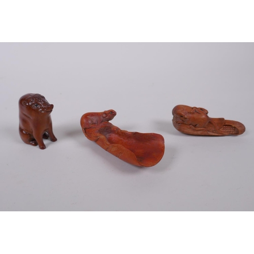 88 - Two Japanese carved boxwood netsuke in the form of rats on a corn husk and a warthog, together with ... 