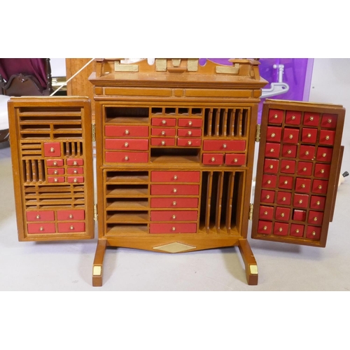 9 - An extensive collection of dolls' house furniture and fittings including carpets, accessories, tea s... 