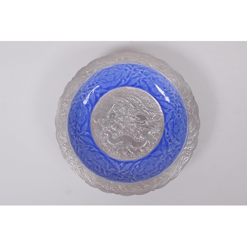 95 - A Chinese blue and silver glazed porcelain dish with lobed rim, decorated with a dragon, phoenix and... 