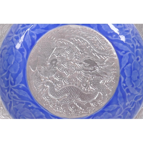 95 - A Chinese blue and silver glazed porcelain dish with lobed rim, decorated with a dragon, phoenix and... 