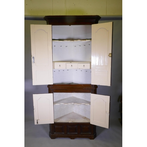 1075 - A Georgian painted pine standing corner cupboard in two sections, arched and fielded door panels, br... 