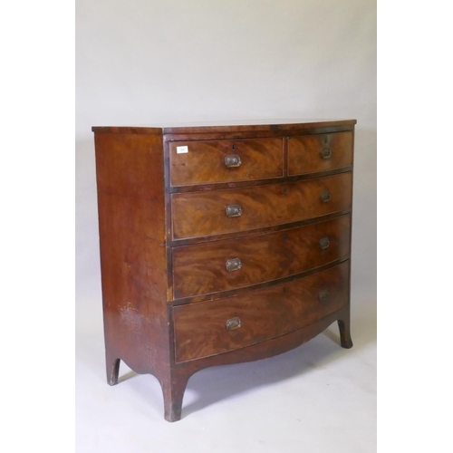 1067 - A Georgian mahogany bowfront chest of two over three drawers with cock beaded detail and brass plate... 