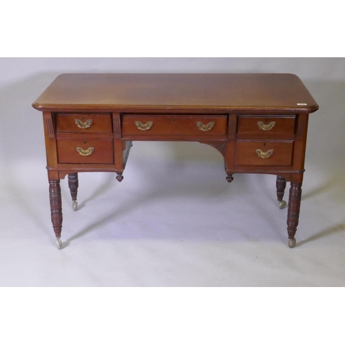 1079 - A Victorian mahogany kneehole desk, the five drawers with moulded fronts and brass handles, raised o... 