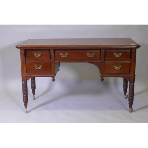 1079 - A Victorian mahogany kneehole desk, the five drawers with moulded fronts and brass handles, raised o... 