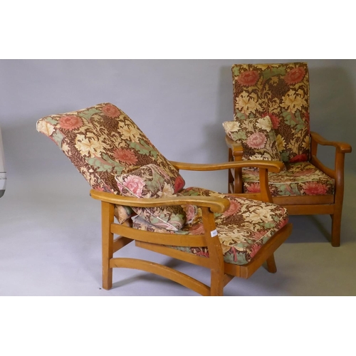 1096 - A pair of mid century beechwood reclining open arm chairs