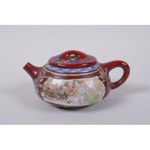 105 - A Chinese YiXing tea pot with enamelled decoration of flowers and a riverside landscape, impressed m... 