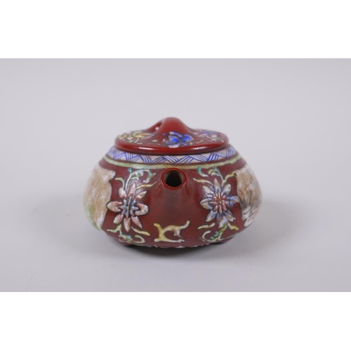 105 - A Chinese YiXing tea pot with enamelled decoration of flowers and a riverside landscape, impressed m... 