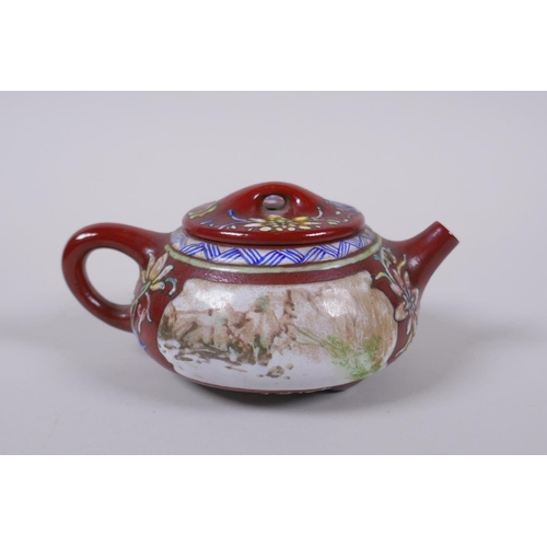 105 - A Chinese YiXing tea pot with enamelled decoration of flowers and a riverside landscape, impressed m... 