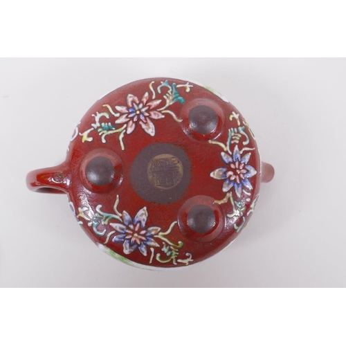 105 - A Chinese YiXing tea pot with enamelled decoration of flowers and a riverside landscape, impressed m... 