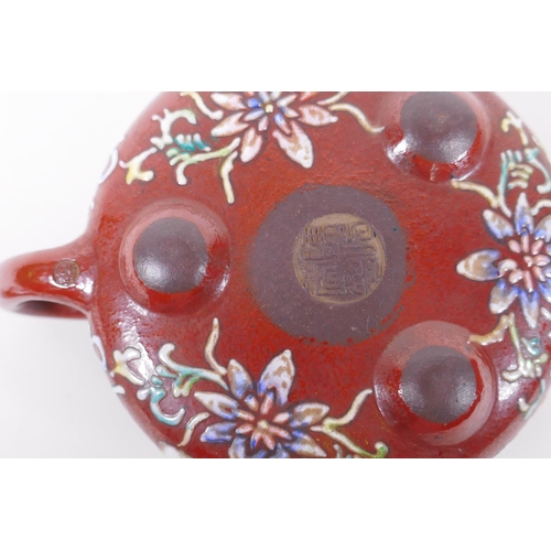 105 - A Chinese YiXing tea pot with enamelled decoration of flowers and a riverside landscape, impressed m... 