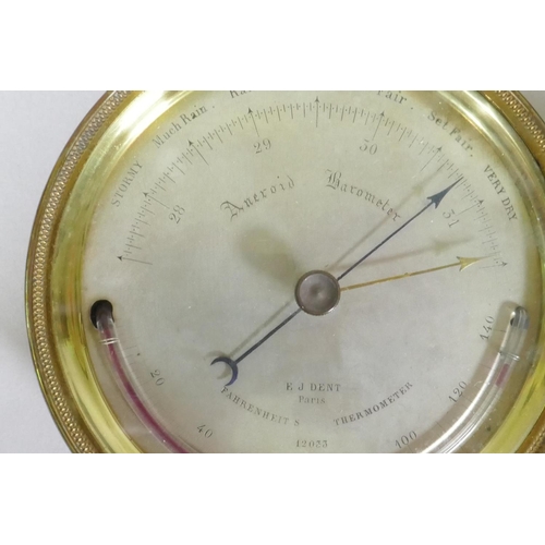 106 - An antique brass cased aneroid barometer, the silvered dial inscribed E.J. Dent, Paris, 12cm diamete... 