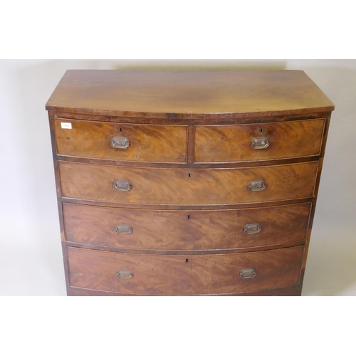 1067 - A Georgian mahogany bowfront chest of two over three drawers with cock beaded detail and brass plate... 