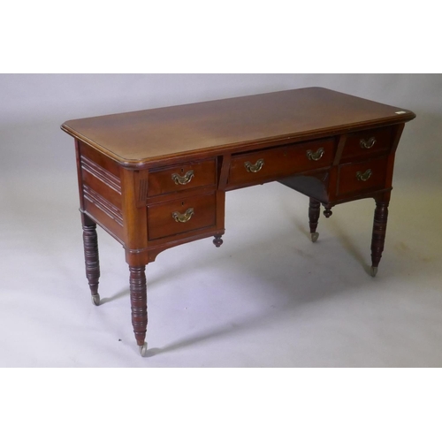 1079 - A Victorian mahogany kneehole desk, the five drawers with moulded fronts and brass handles, raised o... 