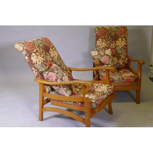 1096 - A pair of mid century beechwood reclining open arm chairs