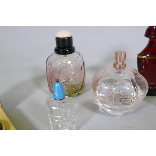 110 - Ten scent bottles, Gucci, Yves St Laurent, Guerlain, Ricci, and a leather cased vanity set