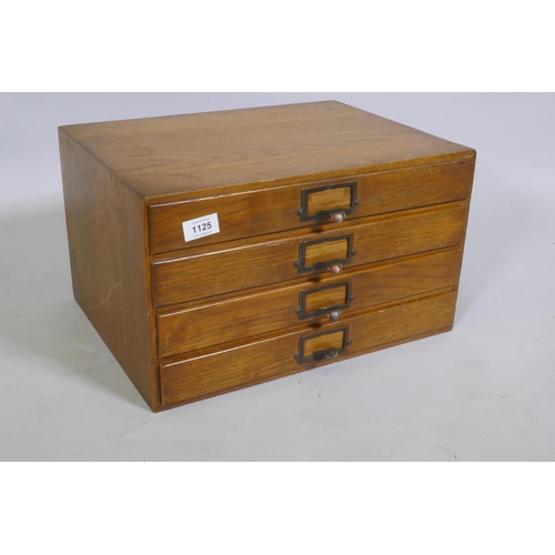 1107 - A vintage oak four drawer filing cabinet, 43 x 32 x 25cm