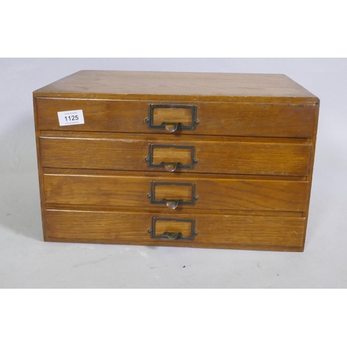 1107 - A vintage oak four drawer filing cabinet, 43 x 32 x 25cm