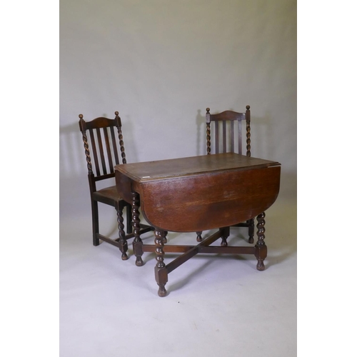 1116 - A Victorian oak drop leaf table, raised on barley twist supports and two chairs, 60 x 91 x 73cm, and... 