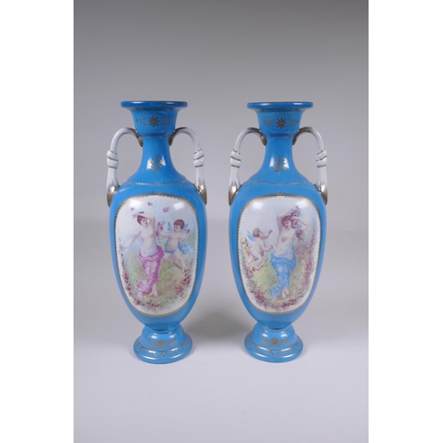 117 - A pair of Sevres style porcelain two handled urns, with decorative panels depicting maidens and wing... 