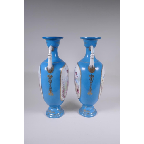 117 - A pair of Sevres style porcelain two handled urns, with decorative panels depicting maidens and wing... 