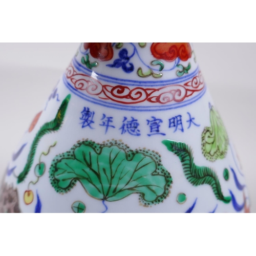 119 - A Wucai porcelain pear shape vase decorated with carp in a lotus pond, Chinese Xuande 6 character ma... 