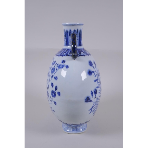 121 - A blue and white porcelain two handled moon flask with floral decoration, Chinese Xuande 6 character... 