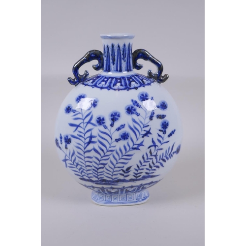 121 - A blue and white porcelain two handled moon flask with floral decoration, Chinese Xuande 6 character... 