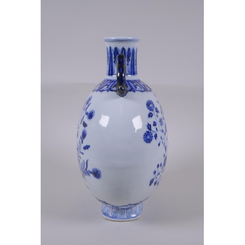 121 - A blue and white porcelain two handled moon flask with floral decoration, Chinese Xuande 6 character... 