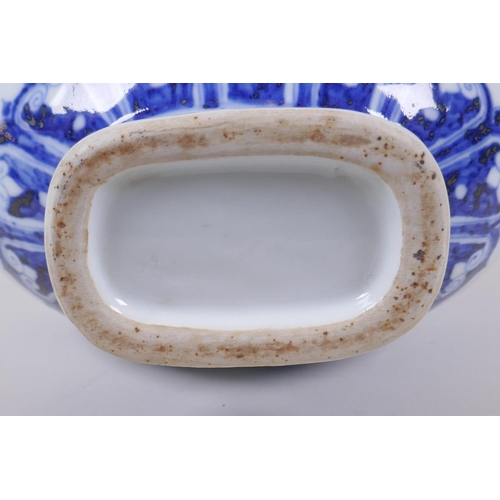 121 - A blue and white porcelain two handled moon flask with floral decoration, Chinese Xuande 6 character... 