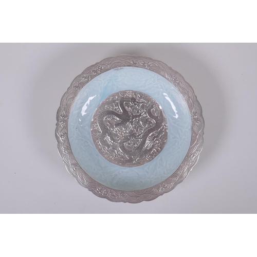 123 - A celadon and silver ground dish with lobed rim and raised dragon decoration, Chinese Qianlong seal ... 