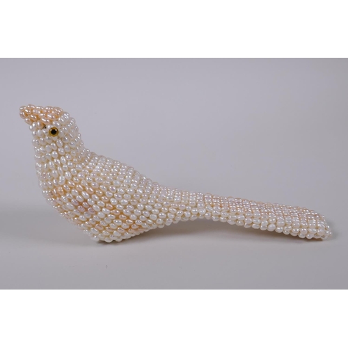 125 - A freshwater pearl model of a bird, 19cm long