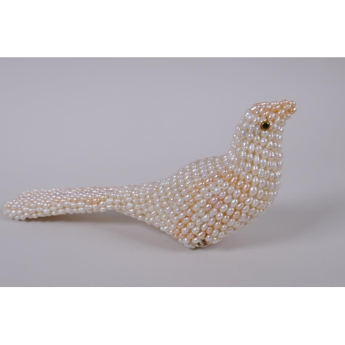 125 - A freshwater pearl model of a bird, 19cm long