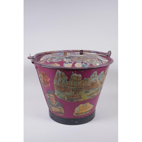 13 - An antique painted galvanised bucket and cover, with decoupage decoration, 28cm x 35cm diameter