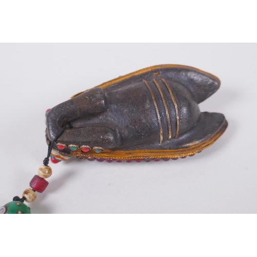 130 - A Tibetan iron toggle in the form of a cicada, the wings set with a dzi bead, abalone, coral and har... 