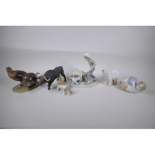 131 - A collection of ceramic animal figures to include Lladro and Nao kittens, a Bing & Grondhal pola... 