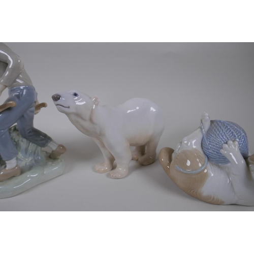 131 - A collection of ceramic animal figures to include Lladro and Nao kittens, a Bing & Grondhal pola... 